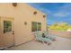 Outdoor balcony features desert views, two loungers, and access door creating an inviting outdoor retreat at 39017 N Habitat Cir, Cave Creek, AZ 85331