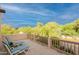 An inviting balcony offers ample views with patio furniture for relaxation and outdoor enjoyment at 39017 N Habitat Cir, Cave Creek, AZ 85331