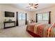 Relaxing bedroom with neutral walls, carpet, and two windows for ample natural light at 39017 N Habitat Cir, Cave Creek, AZ 85331