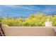 A deck view of desert vegetation, mountain ranges, and scenic vista from the property at 39017 N Habitat Cir, Cave Creek, AZ 85331