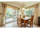 Comfortable dining area featuring a wooden table with backyard view at 39017 N Habitat Cir, Cave Creek, AZ 85331