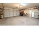 Spacious garage with a clean floor, white door and ample storage space for vehicles and tools at 39017 N Habitat Cir, Cave Creek, AZ 85331