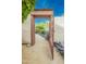 Ornate metal garden gate leading to a serene landscaped backyard, offering privacy and beauty at 39017 N Habitat Cir, Cave Creek, AZ 85331