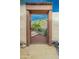 Elegant metal gate provides entry to a meticulously landscaped yard with desert flora and rock features at 39017 N Habitat Cir, Cave Creek, AZ 85331