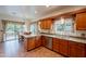 Bright kitchen featuring custom cabinetry, granite countertops, and a stainless steel dishwasher at 39017 N Habitat Cir, Cave Creek, AZ 85331