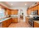 Spacious kitchen with granite countertops, stainless steel appliances, and wood cabinetry at 39017 N Habitat Cir, Cave Creek, AZ 85331