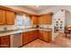 Charming kitchen features granite countertops, wooden cabinets, and stainless steel appliances at 39017 N Habitat Cir, Cave Creek, AZ 85331