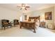 Spacious main bedroom with ceiling fan, and rustic decor at 39017 N Habitat Cir, Cave Creek, AZ 85331