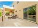 Relaxing outdoor patio with comfortable seating and large sliding glass doors for seamless indoor/outdoor living at 39017 N Habitat Cir, Cave Creek, AZ 85331