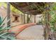 Charming patio area with pergola, banco seating, and desert landscaping, perfect for outdoor relaxation and entertainment at 39017 N Habitat Cir, Cave Creek, AZ 85331