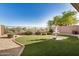 Beautiful backyard with a tiered water fountain feature, neat landscaping, and a desert mountain backdrop at 40713 N Citrus Canyon Trl, Phoenix, AZ 85086