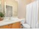 A clean bathroom featuring a vanity with a sink, toilet, and tub shower at 40713 N Citrus Canyon Trl, Phoenix, AZ 85086