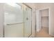 Bright bathroom featuring a glass-enclosed shower and access to an adjoining walk-in closet at 40713 N Citrus Canyon Trl, Phoenix, AZ 85086