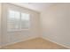 Bedroom showing light neutral walls, tile flooring, and shuttered windows for adjustable lighting at 40713 N Citrus Canyon Trl, Phoenix, AZ 85086
