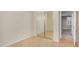 Bedroom view showcasing mirrored closet doors, tile flooring, and neutral colored walls at 40713 N Citrus Canyon Trl, Phoenix, AZ 85086