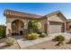 Charming single-story home with a well-manicured front yard and two-car garage, showcasing curb appeal at 40713 N Citrus Canyon Trl, Phoenix, AZ 85086