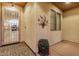 Covered front porch with decorative security door, patterned rug and potted plant accent at 40713 N Citrus Canyon Trl, Phoenix, AZ 85086