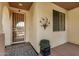 Covered front porch with decorative security door, patterned rug and potted plant accent at 40713 N Citrus Canyon Trl, Phoenix, AZ 85086