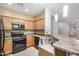 Contemporary kitchen featuring stainless steel appliances and light wood cabinets at 40713 N Citrus Canyon Trl, Phoenix, AZ 85086