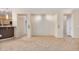 Bright, open-concept living room with tile flooring and neutral paint, leading to adjacent rooms at 40713 N Citrus Canyon Trl, Phoenix, AZ 85086