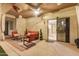 Covered patio featuring outdoor seating, ceiling fan, and direct access to the home's interior at 40713 N Citrus Canyon Trl, Phoenix, AZ 85086
