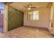 Covered patio with brick pavers and a lush green wall, providing privacy and shade at 40713 N Citrus Canyon Trl, Phoenix, AZ 85086