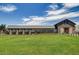 Exterior view of the community clubhouse at Bella Vista Farms, showcasing manicured lawns at 4227 E Kolin Ln, San Tan Valley, AZ 85143