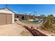 Private backyard oasis features a pool, patio, shed, and lush landscaping for outdoor enjoyment at 4803 W Harmont Dr, Glendale, AZ 85302