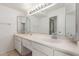 Bathroom featuring double sinks and a large mirror at 4803 W Harmont Dr, Glendale, AZ 85302