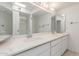Bathroom boasts a dual sink vanity with a large mirror and a separate shower at 4803 W Harmont Dr, Glendale, AZ 85302