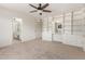 Spacious bedroom with built-in storage and an en suite bathroom at 4803 W Harmont Dr, Glendale, AZ 85302
