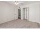 Bedroom featuring a closet for storage and neutral carpet, blending style and practicality at 4803 W Harmont Dr, Glendale, AZ 85302