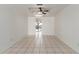 Neutral dining room with tile floor and ceiling fan at 4803 W Harmont Dr, Glendale, AZ 85302