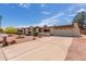 Single level home with a neutral color scheme, rock landscaping, and a two car garage at 4803 W Harmont Dr, Glendale, AZ 85302