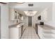 Bright kitchen with white cabinets and appliances at 4803 W Harmont Dr, Glendale, AZ 85302