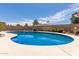 Inviting in-ground pool with patio and serene landscaping offers a refreshing escape and relaxation at 4803 W Harmont Dr, Glendale, AZ 85302