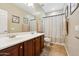 Bathroom with double vanity, neutral tile and framed mirrors at 5136 W Trotter Trl, Phoenix, AZ 85083