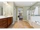 Bathroom with vanity, walk-in shower, and large tub at 5136 W Trotter Trl, Phoenix, AZ 85083