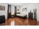 Bright bedroom featuring hardwood floors, window shutters, and stylish decor at 5136 W Trotter Trl, Phoenix, AZ 85083
