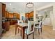 Elegant dining area with tile floors, wooden cabinets, and an open view to the living area at 5136 W Trotter Trl, Phoenix, AZ 85083