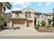 Charming two-story home with a terracotta roof and a well-maintained three-car garage at 5136 W Trotter Trl, Phoenix, AZ 85083