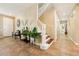 Bright and open foyer with a staircase and tile flooring, creating a welcoming entrance at 5136 W Trotter Trl, Phoenix, AZ 85083