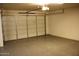 Spacious garage with epoxy flooring and white door at 5136 W Trotter Trl, Phoenix, AZ 85083