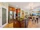 A bright kitchen features a center island, cherry cabinets, and stainless steel appliances at 5136 W Trotter Trl, Phoenix, AZ 85083