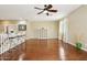 Open living room with hardwood floors, ceiling fan, and a bright, airy feel at 5136 W Trotter Trl, Phoenix, AZ 85083