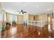 Bright, open living room with hardwood floors, ceiling fan, and staircase access at 5136 W Trotter Trl, Phoenix, AZ 85083