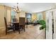 Spacious living and dining area featuring tile floors, ample natural light, and elegant furnishings at 5136 W Trotter Trl, Phoenix, AZ 85083