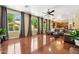 Bright and airy living space featuring hardwood floors, large windows, and a view of the backyard at 5136 W Trotter Trl, Phoenix, AZ 85083