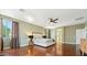 Spacious main bedroom with hardwood floors, ceiling fan, and walk-in closet at 5136 W Trotter Trl, Phoenix, AZ 85083