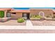 Charming single-story home with desert landscaping, tiled roof, and walkway to the front door at 520 W Hononegh Dr # 2, Phoenix, AZ 85027